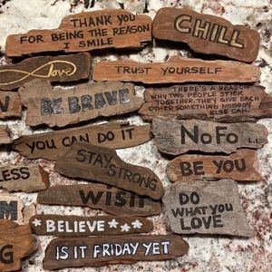 Motivational driftwood signs